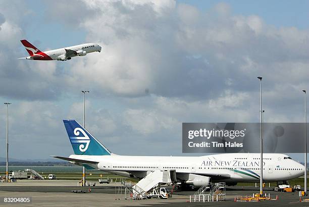 Qantas A380 Airbus takes off in front of an Air New Zealand 747 at Auckland International Airport October 10, 2008 in Auckland, New Zealand. The...