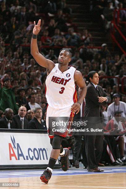 Dwyane Wade of the Miami Heat celebrates after hitting a shot during the preseason game against the New Jersey Nets as part of the 2008 NBA Europe...