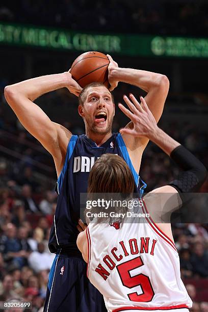 Dirk Nowitzki of the Dallas Mavericks looks to pass against Andres Nocioni of the Chicago Bulls on October 9, 2008 at the United Center in Chicago,...