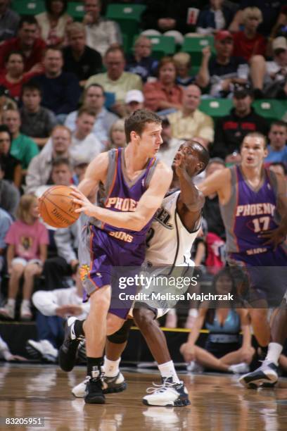 Brevin Knight of the Utah Jazz guards Goran Dragic of the Phoenix Suns at EnergySolutions Arena on October 09, 2008 in Salt Lake City, Utah. NOTE TO...