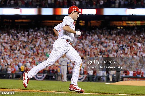 Pat Burrell of of the Philadelphia Phillies ronuds the bases after hitting a solo home run to give the Phillies a 3-2 lead in the bottom of the sixth...