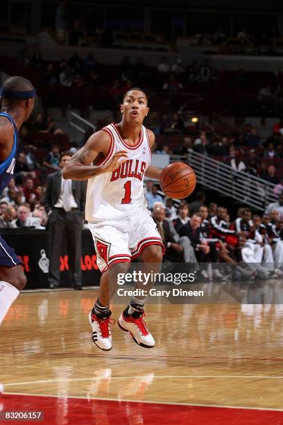 Derrick Rose of the Chicago Bulls looks to pass against Jason Terry of the Dallas Mavericks while attempting a dunk at the United Center on October...