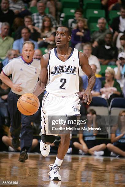 Brevin Knight of the Utah Jazz dribbles down court against the Phoenix Suns at EnergySolutions Arena on October 09, 2008 in Salt Lake City, Utah....