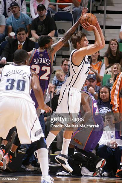 Kyle Korver of the Utah Jazz is blocked by Matt Barnes of the Phoenix Suns at EnergySolutions Arena on October 09, 2008 in Salt Lake City, Utah. NOTE...