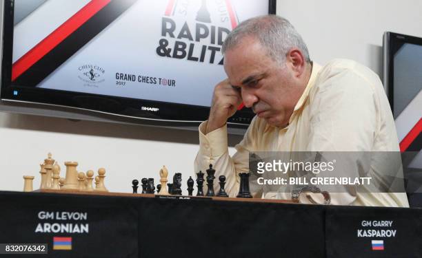 Grandmaster chess player Garry Kasparov checks his next move during a match against fellow grandmaster Levon Aronian on day two of the Grand Chess...