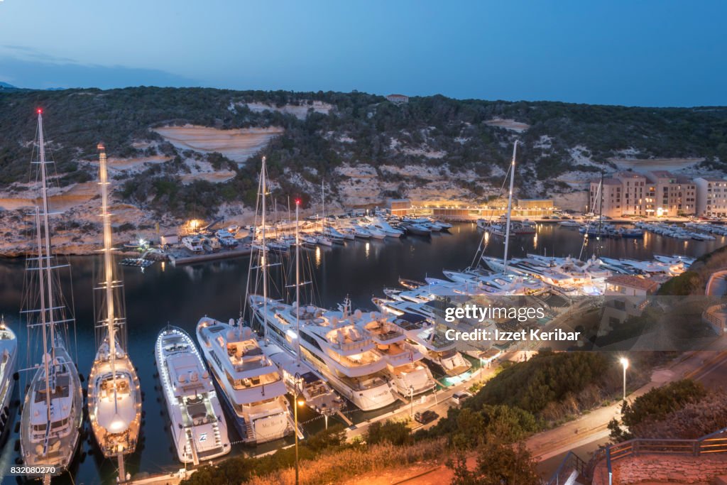 Port of Bonifacio, and motoryachts and sail boats  evening picture, Corse du Sud, Corsica, France