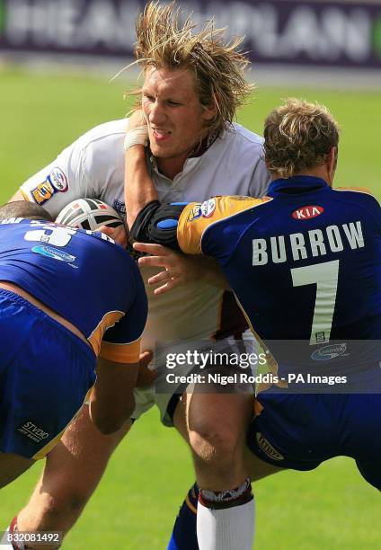 Leeds Rhino's Chev Walker and Rob Burrow tackle Huddersfield Giant's Eorl Crabtree during the Powergen Challenge Cup semi-final at The Grattan...