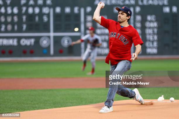Actor Casey Affleck throws out the first pitch before the game between the Boston Red Sox and the St. Louis Cardinals at Fenway Park on August 15,...