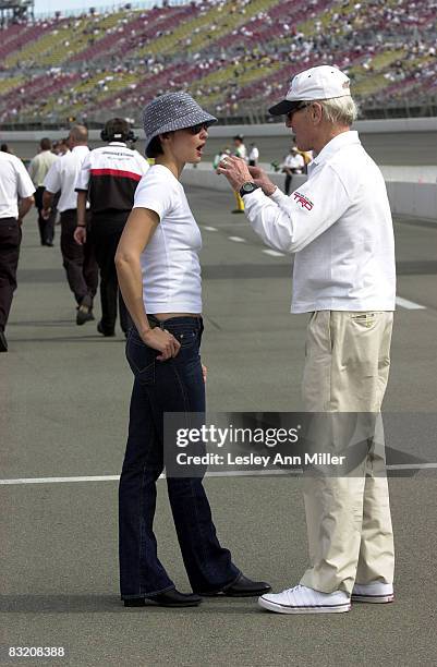 Paul Newman and Ashley Judd enjoy a moment prior to the race
