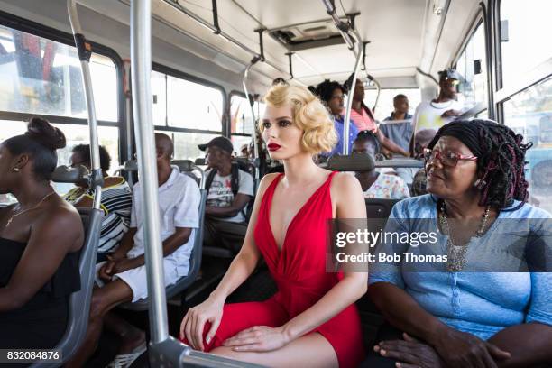 glamour on the bus - black woman red dress stock pictures, royalty-free photos & images