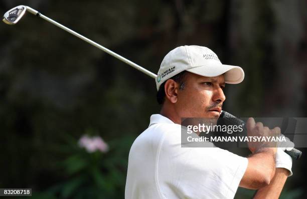 Indian golfer Jeev Milkha Singh tees off during the second round of the Hero Honda Indian Open at the Delhi Golf Club in New Delhi on October 10,...