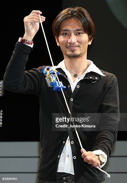One of Japan's leading robot creator's Tomotaka Takahashi holds "Evolta" during the Robo_Japan 2008 Press Preview at Pacifico Yokohama on October 10,...