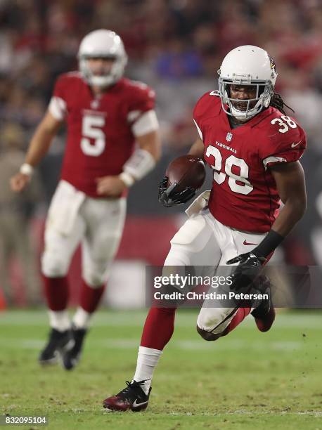 Running back Andre Ellington of the Arizona Cardinals rushes the football against the Oakland Raiders during the NFL game at the University of...