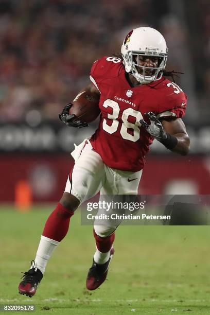 Running back Andre Ellington of the Arizona Cardinals rushes the football against the Oakland Raiders during the NFL game at the University of...