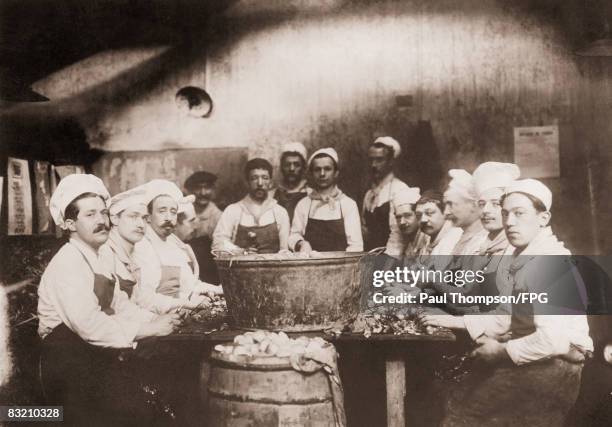 Cooks at the messagerie in Ghent prepare food for destitute Belgians during World War I, circa 1918.