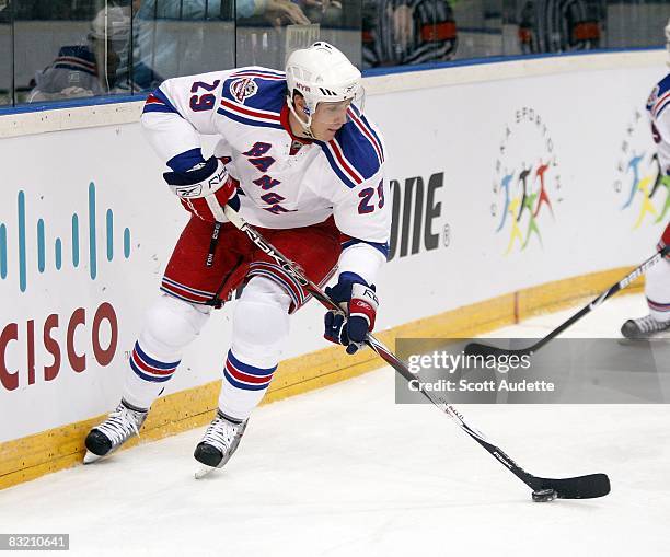 Lauri Korpikoski of the New York Rangers skates with the puck against the Tampa Bay Lightning during the second period at the NHL Premiere game on...