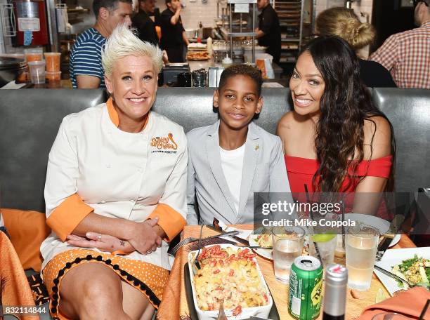 Celebrity chef Anne Burrell, Kiyan Anthony and La La Anthony pose for a photo as The Spotted Cheetah opens in New York City, serving up a...