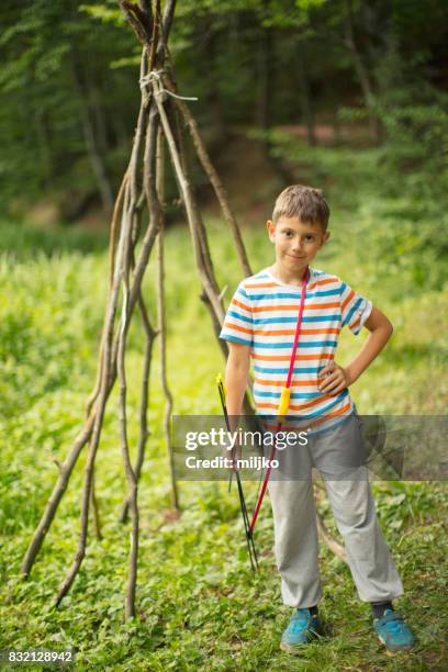 archer boy in nature - wigwam stock pictures, royalty-free photos & images