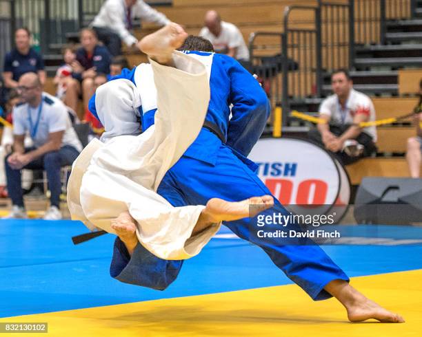 Sebastian Junk of Germany throws Federico Dura of Italy with a sweeping hip throw for ippon to win their u81kgs repechage contest during the IBSA VI...