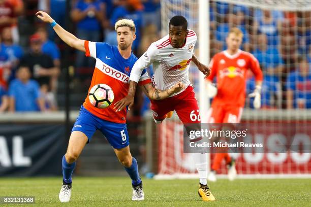 Cincinnati midfielder Aodhan Quinn battles New York Red Bull defender Michael Murillo during the semifinal match of the 2017 Lamar Hunt U.S. Open Cup...