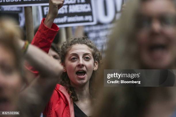 Demonstrator chants during the "Defend DACA & TPS" rally outside of Trump Tower in New York, U.S., on Tuesday, Aug. 15, 2017. A day after belatedly...