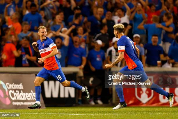 Cincinnati midfielder Corben Bone celebrates with Aodhan Quinn after scoring a goal in the first half against the New York Red Bulls during the...