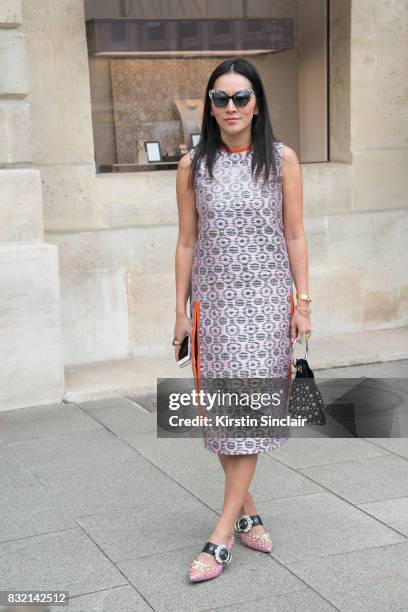 Fashion stylist Tina Leung wears a Marni dress, Miu Miu shoes, Delphine Delafon bag and Prism sunglasses day 2 of Paris Haute Couture Fashion Week...