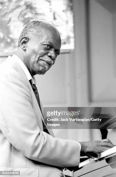 American Jazz musician Hank Jones plays piano as he performs at the 3rd Annual Charlier Parker Jazz Festival in Tompkins Square Park, New York, New...