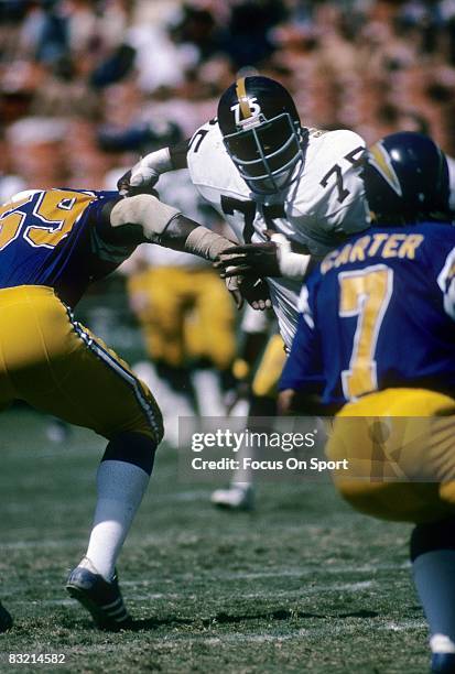 S: Defensive lineman Joe Greene of the Pittsburgh Steelers throws the San Diego Charges offensive lineman aside as he rushes the passer during a late...