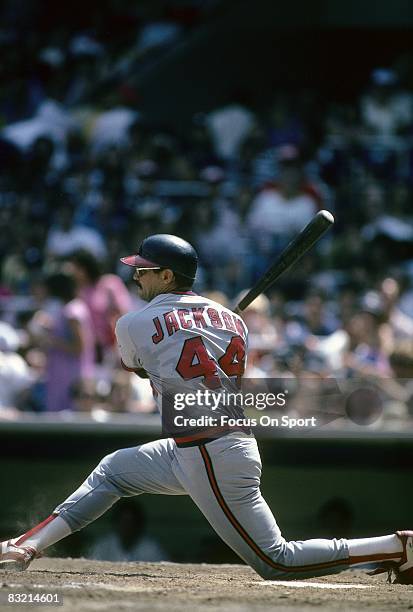 S: Outfielder Reggie Jackson of the California Angles swings and watches the flight of his ball against the New York Yankees during a circa 1980's...