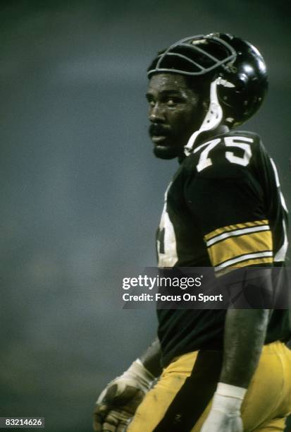 S: Defensive lineman Joe Greene of the Pittsburgh Steelers on the field while there is a break in the action during a mid circa 1970's NFL football...