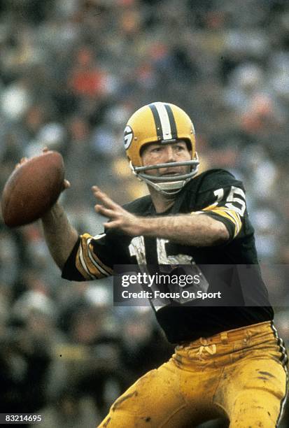 S: Bart Starr quarterback of the Green Bay Packers throws a pass against the Cleveland Browns during a circa 1960's NFL game at Lambeau Field in...