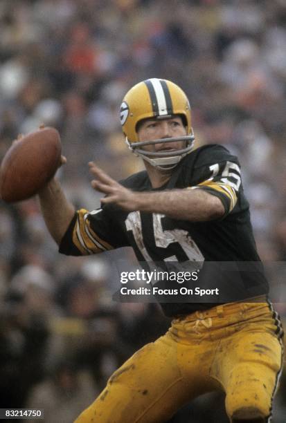 S: Bart Starr quarterback of the Green Bay Packers throws a pass against the Cleveland Browns during a circa 1960's NFL game at Lambeau Field in...