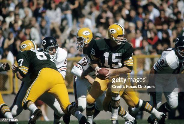 S: Bart Starr quarterback of the Green Bay Packers turns to hands the ball off against the Chicago Bears during a circa 1960's NFL game at Lambeau...
