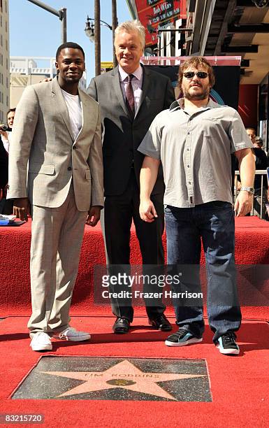Actor Tim Robbins poses on the Hollywood Walk of Fame with Derek Luke and Jack Black after receiving his star on October 10, 2008 in Hollywood...