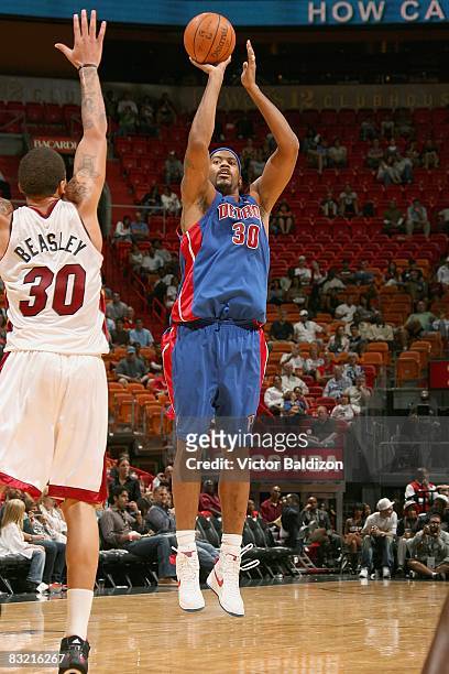Rasheed Wallace of the Detroit Pistons shoots a jumper against Michael Beasley of the Miami Heat during the preseason game on October 5, 2008 at the...