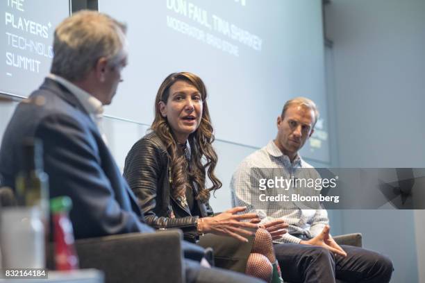 Tina Sharkey, co-founder and chief executive officer of Brandless Inc., center, speaks as Don Faul, chief executive officer of Athos, right, listens...