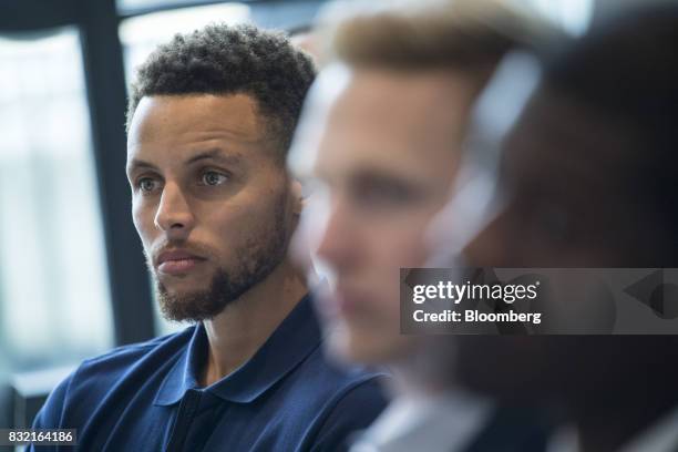 Stephen Curry, a professional basketball player with the National Basketball Association's Golden State Warriors, listens to a panel discussion...