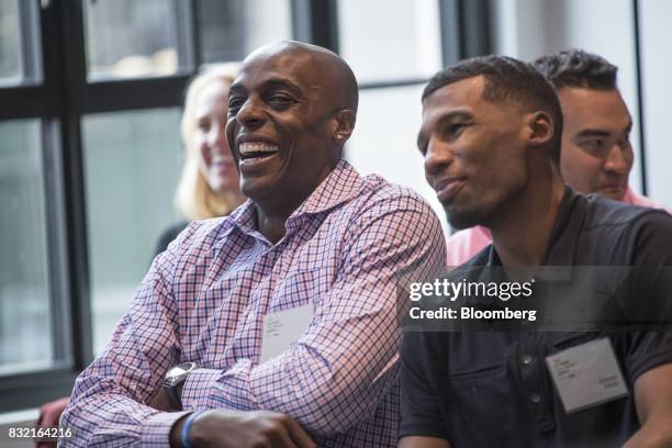 Anthony Tolliver, a professional basketball player with the National Basketball Association's Detroit Pistons, left, and Ronnie Price, a professional...