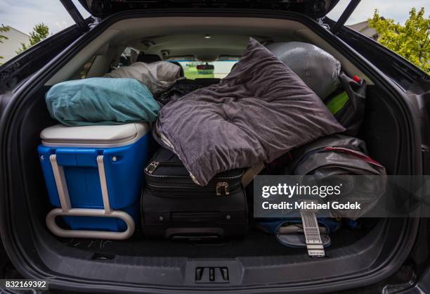 car truck packed with luggage and other items for road trip - full car trunk stock pictures, royalty-free photos & images