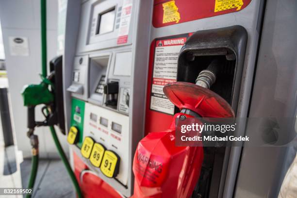 gas pump close up during day time - gallone stock-fotos und bilder