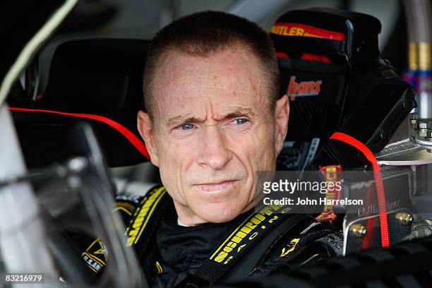 Mark Martin, driver of the U.S. Army Chevrolet, sits in his car in the garage area during practice for the NASCAR Sprint Cup Series Bank of America...