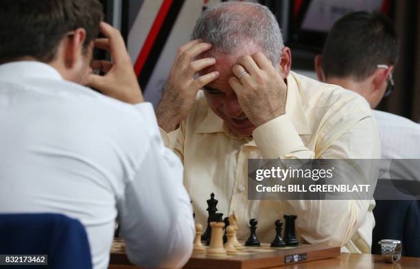 Grandmaster chess player Garry Kasparov contemplates his move during a match against fellow grandmaster Levon Aronian on day two of the Grand Chess...