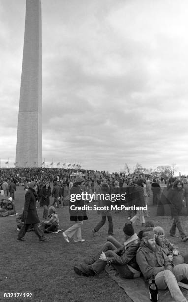 Washington, DC : Thousands of activists gather in front of the Washington Monument on a cold January day, protesting the Vietnam War, and Richard...