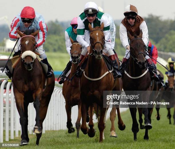 Tartouche ridden by jockey Seb Saunders wins the Lillie Langtry Fillies' Stakes at Goodwood racecourse.