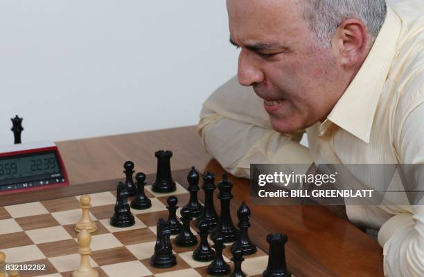 Grandmaster chess player Garry Kasparov scowles at the chessboard during a match against grandmaster Levon Aronian during day two of the Grand Chess...