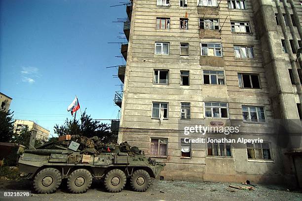 Russian APC loaded down with supplies is parked, protecting this 20 story building on August 15, 2008 in Tskhinvali, South Ossetia. Hundreds of...