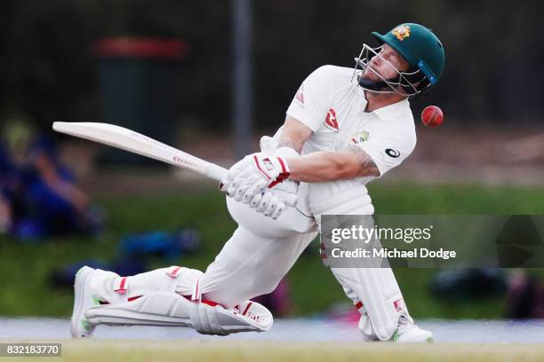 Matthew Wade of Australia is hit on the helmet from a Nathan Lyon delivery during day three of the Australian Test cricket inter-squad match at...