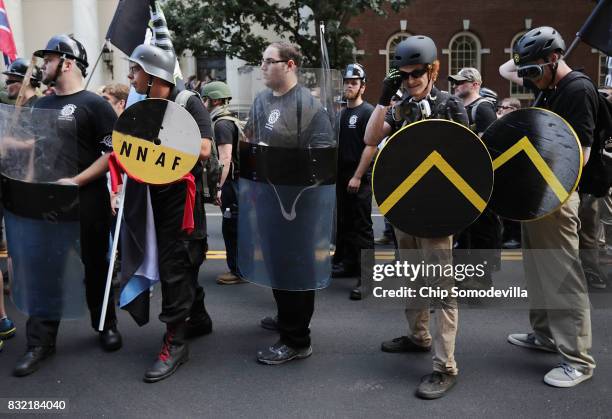 Hundreds of white nationalists, neo-Nazis and members of the "alt-right" march down East Market Street toward Emancipation Park during the United the...