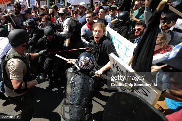 White nationalists, neo-Nazis and members of the "alt-right" clash with counter-protesters as they enter Emancipation Park during the Unite the Right...